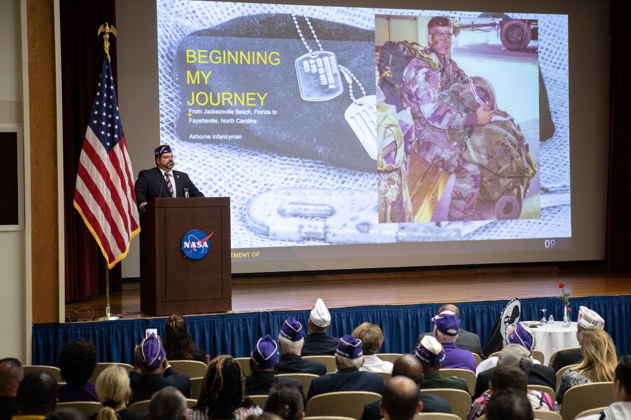 Christopher Vedvick, a combat wounded veteran and Military Order of the Purple Heart department of Florida commander, speaks at a Veterans Day observance event on Nov. 7, 2019, in the Kennedy Space Center Training Auditorium. During the event, Kennedy was named a Purple Heart Entity by the Military Order of the Purple Heart, becoming the first NASA center to receive this designation for support and services provided to veterans through the Florida spaceport’s Veterans employee resource group. Attendees included Kennedy employees and more than 20 Purple Heart recipients.