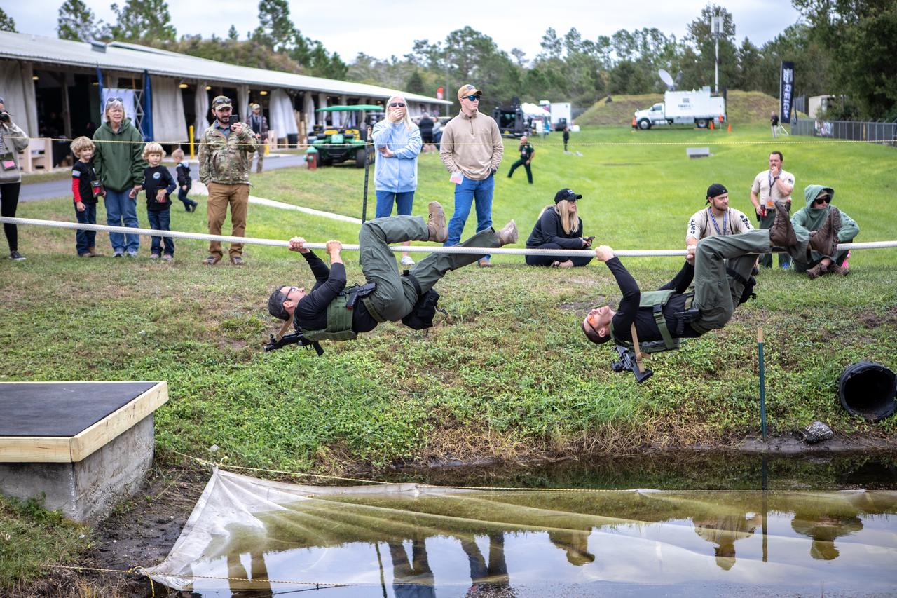 Members of NASA Kennedy Space Center's Emergency Response Team work their way along a rope above water during one of the tactical challenges at the 37th Annual SWAT Round-Up International at the Lawson Lamar Firearms and Tactical Training Center in Orlando, Florida. The competition was held Nov. 10 to 15, 2019, and featured five different tactical challenges. Kennedy's ERT members exchanged best practices and competed with more than 50 teams from the U.S. and around the world.