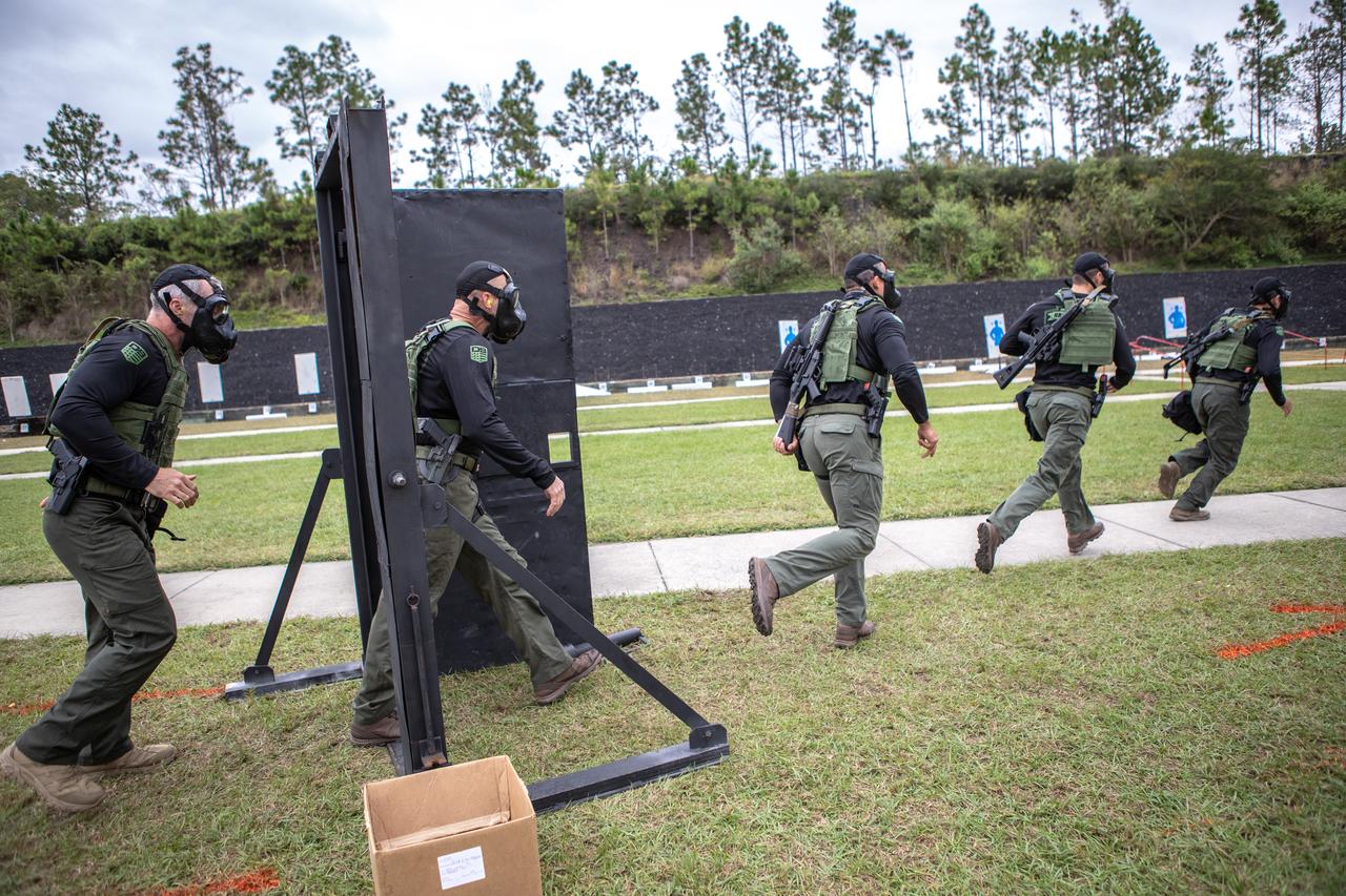 Members of NASA Kennedy Space Center's Emergency Response Team break through a barricade and run through to the other side during one of the tactical challenges at the 37th Annual SWAT Round-Up International at the Lawson Lamar Firearms and Tactical Training Center in Orlando, Florida. The competition was held Nov. 10 to 15, 2019, and featured five different tactical challenges. Kennedy's ERT members exchanged best practices and competed with more than 50 teams from the U.S. and around the world.