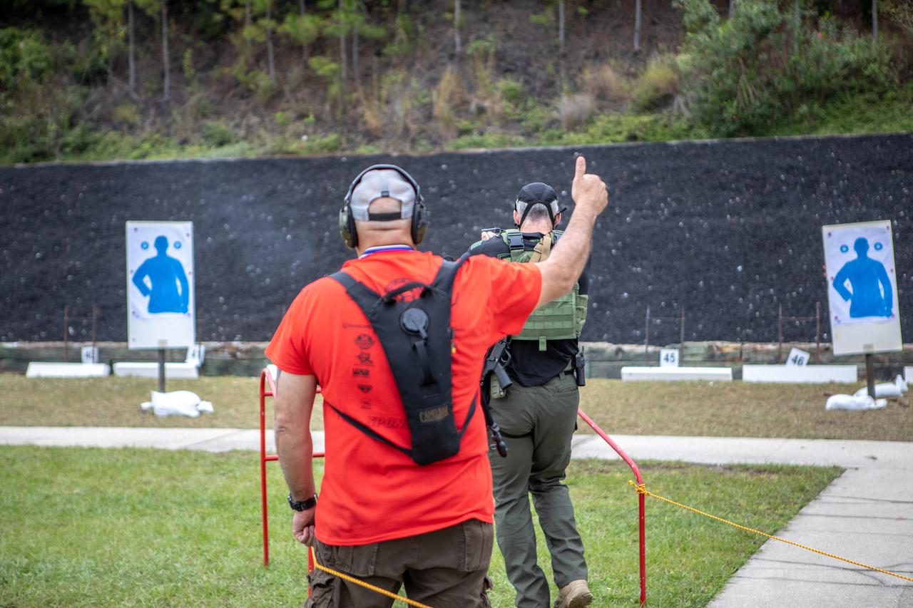 A member of NASA Kennedy Space Center's Emergency Response Team waits for the signal from the judge and then takes aim to shoot at a target with a handgun during one of the tactical challenges at the 35th Annual SWAT Round-up International at the Lawson Lamar Firearms and Tactical Training Center in Orlando, Florida. The competition was held Nov. 10 to 15, 2019, and featured five different tactical challenges. Kennedy's ERT members exchanged best practices and competed with more than 50 teams from the U.S. and around the world.