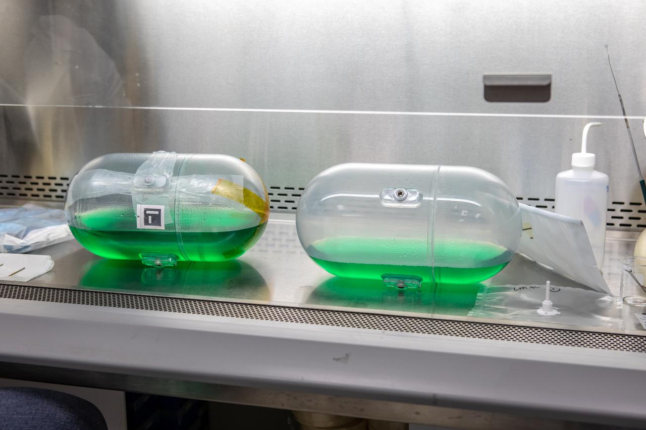 Researchers from NASA’s Kennedy Space Center Air and Water Revitalization lab are studying two tanks, containing water with green dye, inside the Neil Armstrong Operations and Checkout Building in Florida on Nov. 13, 2019. The tanks have recently returned to Kennedy after remaining on the International Space Station for the past five years, originally sent to space to study slosh – the movement of water – in a zero-gravity environment to help engineers predict the movement of propellant in rocket tanks. With the slosh experiment now concluded, the tanks are being examined to determine if there is, or was, any microbial growth within them. The results will help NASA determine whether clean water can be stored in space for long-duration missions, an essential component to keeping astronauts safe and healthy as the agency prepares for missions to the Moon and beyond to Mars. 