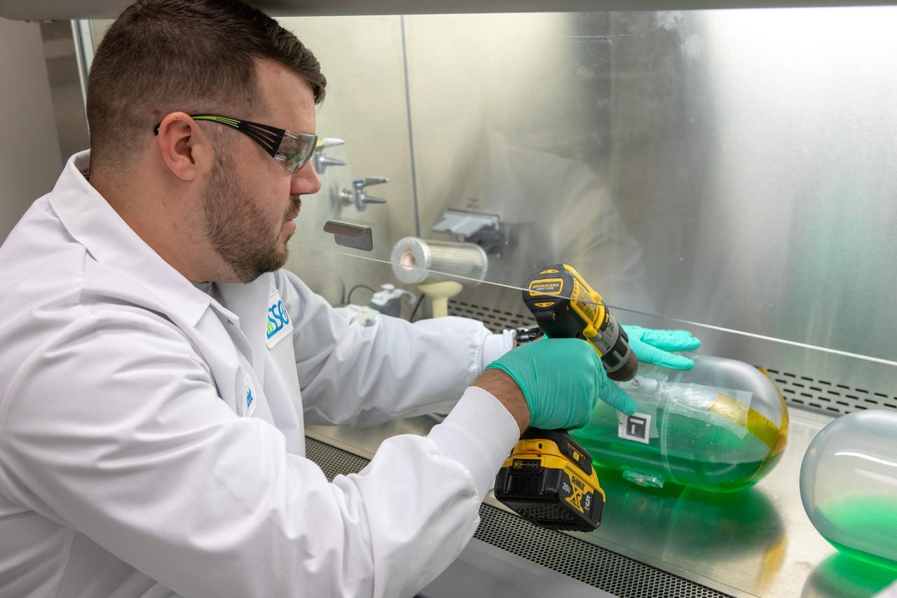 Kennedy Space Center’s Brint Bauer drills into a water tank, filled with green dye, in the Florida spaceport’s Neil Armstrong Operations and Checkout Building on Nov. 13, 2019. Two tanks have recently returned to Kennedy after spending the last five years on the International Space Station for an experiment to study slosh, or the movement of water, in a zero-gravity environment to help engineers predict the movement of propellant in rocket tanks. With the slosh experiment now concluded, Kennedy’s Air and Water Revitalization lab is studying the water tanks to determine if there is, or was, any microbial growth within them. The results will help NASA determine whether clean water can be stored in space for long-duration missions, an essential component to keeping astronauts safe and healthy as the agency prepares for missions to the Moon and beyond to Mars. 