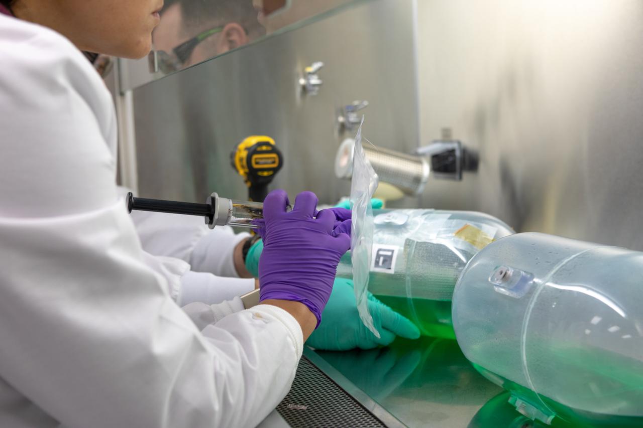 A Kennedy Space Center employee collects samples from a water tank, filled with green dye, for a biological study in the Florida spaceport’s Neil Armstrong Operations and Checkout Building on Nov. 13, 2019. Two tanks have recently returned to Kennedy after spending the last five years on the International Space Station for an experiment to study slosh, or the movement of water, in a zero-gravity environment to help engineers predict the movement of propellant in rocket tanks. With the slosh experiment now concluded, Kennedy’s Air and Water Revitalization lab is studying the water tanks to determine if there is, or was, any microbial growth within them. The results will help NASA determine whether clean water can be stored in space for long-duration missions, an essential component to keeping astronauts safe and healthy as the agency prepares for missions to the Moon and beyond to Mars. 