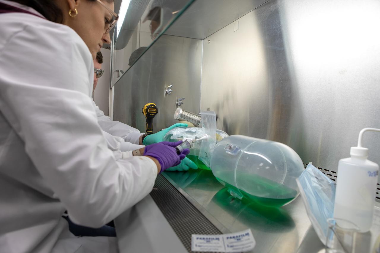 Kennedy Space Center’s Carolina Franco, Ph.D., collects samples from a water tank, filled with green dye, for a biological study in the Florida spaceport’s Neil Armstrong Operations and Checkout Building on Nov. 13, 2019. Two tanks have recently returned to Kennedy after spending the last five years on the International Space Station for an experiment to study slosh, or the movement of water, in a zero-gravity environment to help engineers predict the movement of propellant in rocket tanks. With the slosh experiment now concluded, Kennedy’s Air and Water Revitalization lab is studying the water tanks to determine if there is, or was, any microbial growth within them. The results will help NASA determine whether clean water can be stored in space for long-duration missions, an essential component to keeping astronauts safe and healthy as the agency prepares for missions to the Moon and beyond to Mars. 