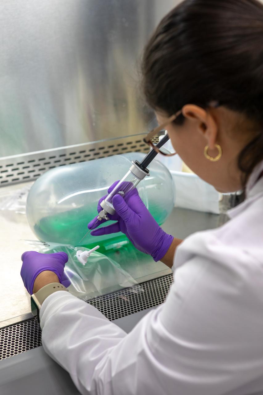 Kennedy Space Center’s Carolina Franco, Ph.D., collects samples from a water tank, filled with green dye, for a biological study in the Florida spaceport’s Neil Armstrong Operations and Checkout Building on Nov. 13, 2019. Two tanks have recently returned to Kennedy after spending the last five years on the International Space Station for an experiment to study slosh, or the movement of water, in a zero-gravity environment to help engineers predict the movement of propellant in rocket tanks. With the slosh experiment now concluded, Kennedy’s Air and Water Revitalization lab is studying the water tanks to determine if there is, or was, any microbial growth within them. The results will help NASA determine whether clean water can be stored in space for long-duration missions, an essential component to keeping astronauts safe and healthy as the agency prepares for missions to the Moon and beyond to Mars. 