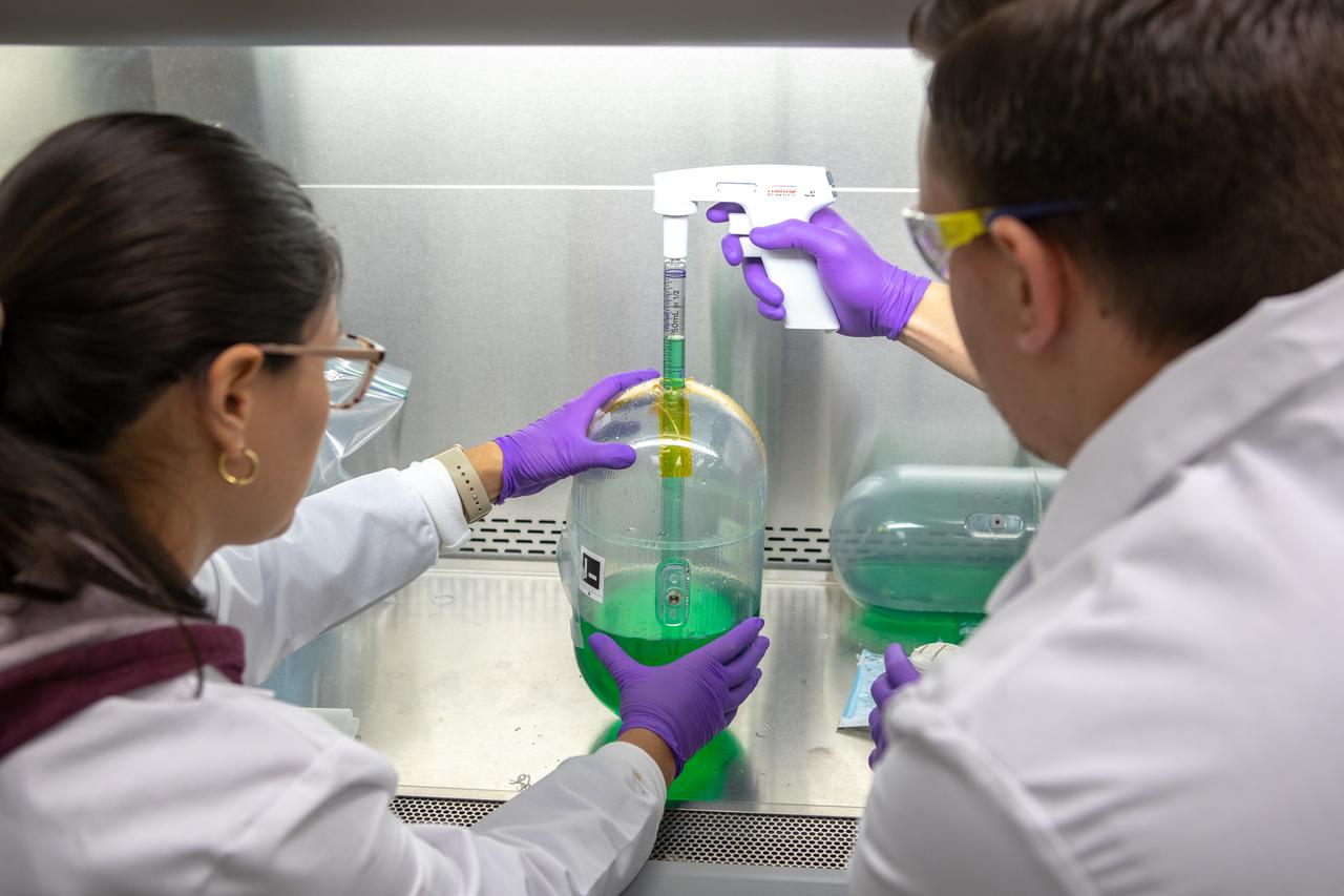 Kennedy Space Center’s Carolina Franco, Ph.D., left, and Jason Fischer collect samples from a water tank, filled with green dye, for a biological study in the Florida spaceport’s Neil Armstrong Operations and Checkout Building on Nov. 13, 2019. Two tanks have recently returned to Kennedy after spending the last five years on the International Space Station for an experiment to study slosh, or the movement of water, in a zero-gravity environment to help engineers predict the movement of propellant in rocket tanks. Kennedy’s Air and Water Revitalization lab is studying the water tanks to determine if there is, or was, any microbial growth within them. The results will help NASA determine whether clean water can be stored in space for long-duration missions, an essential component to keeping astronauts safe and healthy as the agency prepares for missions to the Moon and beyond to Mars. 