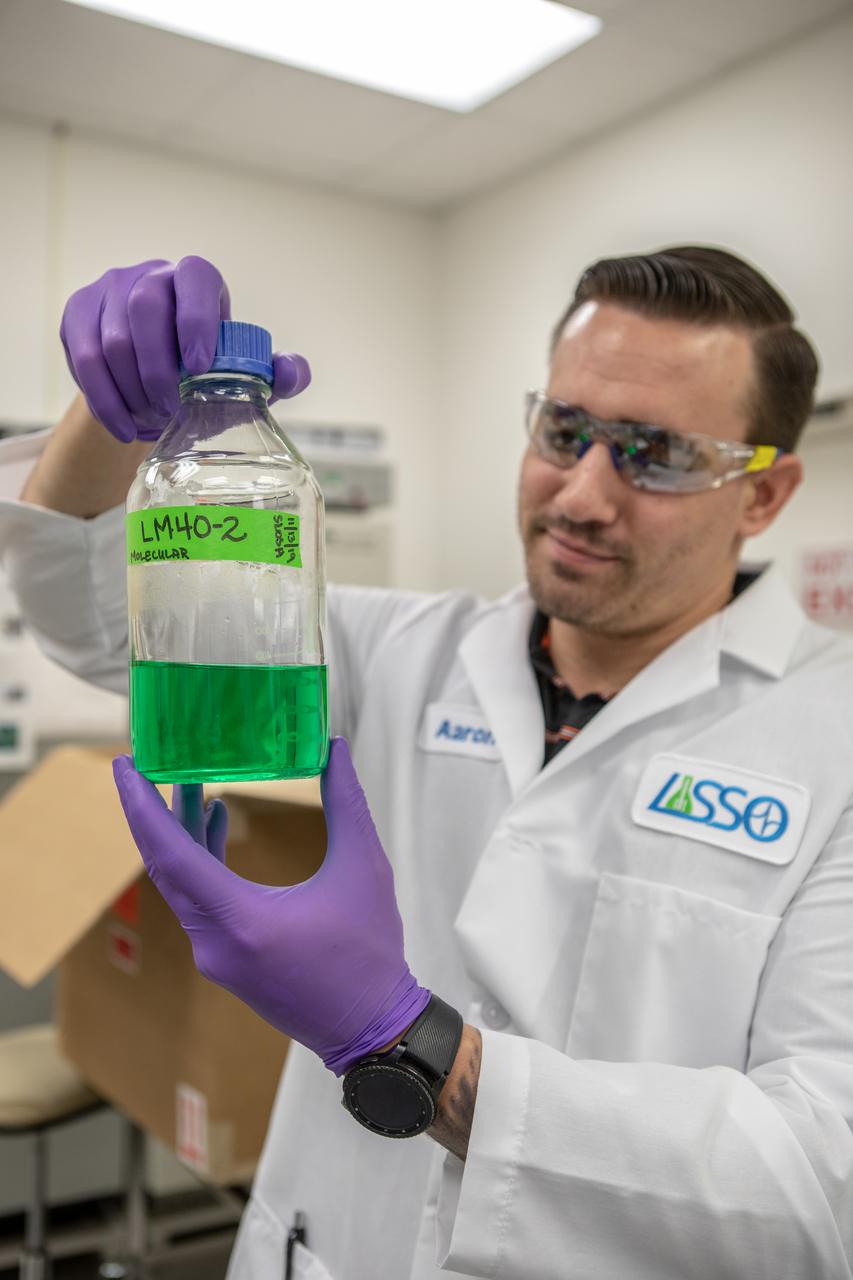 Kennedy Space Center’s Jason Fischer holds a sample of water in the Florida spaceport’s Neil Armstrong Operations and Checkout Building on Nov. 13, 2019. Two tanks of water have recently returned to Kennedy after spending the last five years on the International Space Station for an experiment to study slosh, or the movement of water, in a zero-gravity environment to help engineers predict the movement of propellant in rocket tanks. Kennedy’s Air and Water Revitalization lab is studying the water tanks to determine if there is, or was, any microbial growth within them. The results will help NASA determine whether clean water can be stored in space for long-duration missions, an essential component to keeping astronauts safe and healthy as the agency prepares for missions to the Moon and beyond to Mars. 