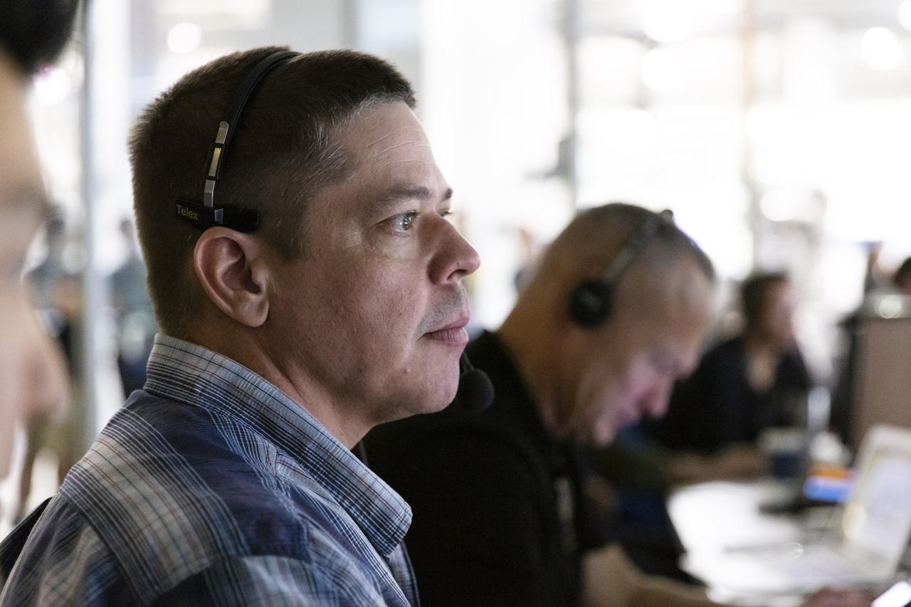 NASA astronauts Doug Hurley, left, and Bob Behnken, seated at consoles inside SpaceX Mission Control in Hawthorne, California, monitor the Crew Dragon spacecraft static fire engine tests taking place at Cape Canaveral Air Force Station in Florida on Nov. 13, 2019. The tests will help validate the Crew Dragon’s launch escape system ahead of the upcoming in-flight abort demonstration as part of NASA’s Commercial Crew Program. Behnken and Hurley will be the first astronauts to fly aboard Crew Dragon in SpaceX’s Demo-2 mission to the International Space Station.