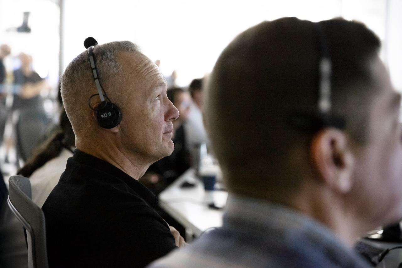 NASA astronauts Doug Hurley, left, and Bob Behnken, seated at consoles inside SpaceX Mission Control in Hawthorne, California, monitor the Crew Dragon spacecraft static fire engine tests taking place at Cape Canaveral Air Force Station in Florida on Nov. 13, 2019. The tests will help validate the Crew Dragon’s launch escape system ahead of the upcoming in-flight abort demonstration as part of NASA’s Commercial Crew Program. Behnken and Hurley will be the first astronauts to fly aboard Crew Dragon in SpaceX’s Demo-2 mission to the International Space Station.