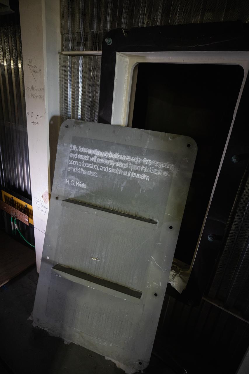 Each of the eight haunch access doors located in the mobile launcher platform contains an inspirational quote related to space travel. The quotes are from John F. Kennedy, H.G. Wells and Werner Von Braun, among others. The heavy metal doors will be bolted in place to protect electrical and support systems during liftoff of the Space Launch System rocket and Orion spacecraft.