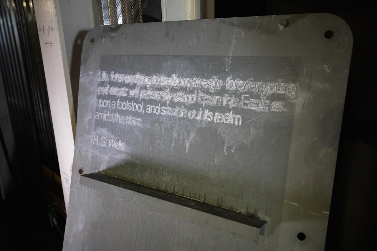 Each of the eight haunch access doors located in the mobile launcher platform contains an inspirational quote related to space travel. The quotes are from John F. Kennedy, H.G. Wells and Werner Von Braun, among others. The heavy metal doors will be bolted in place to protect electrical and support systems during liftoff of the Space Launch System rocket and Orion spacecraft.