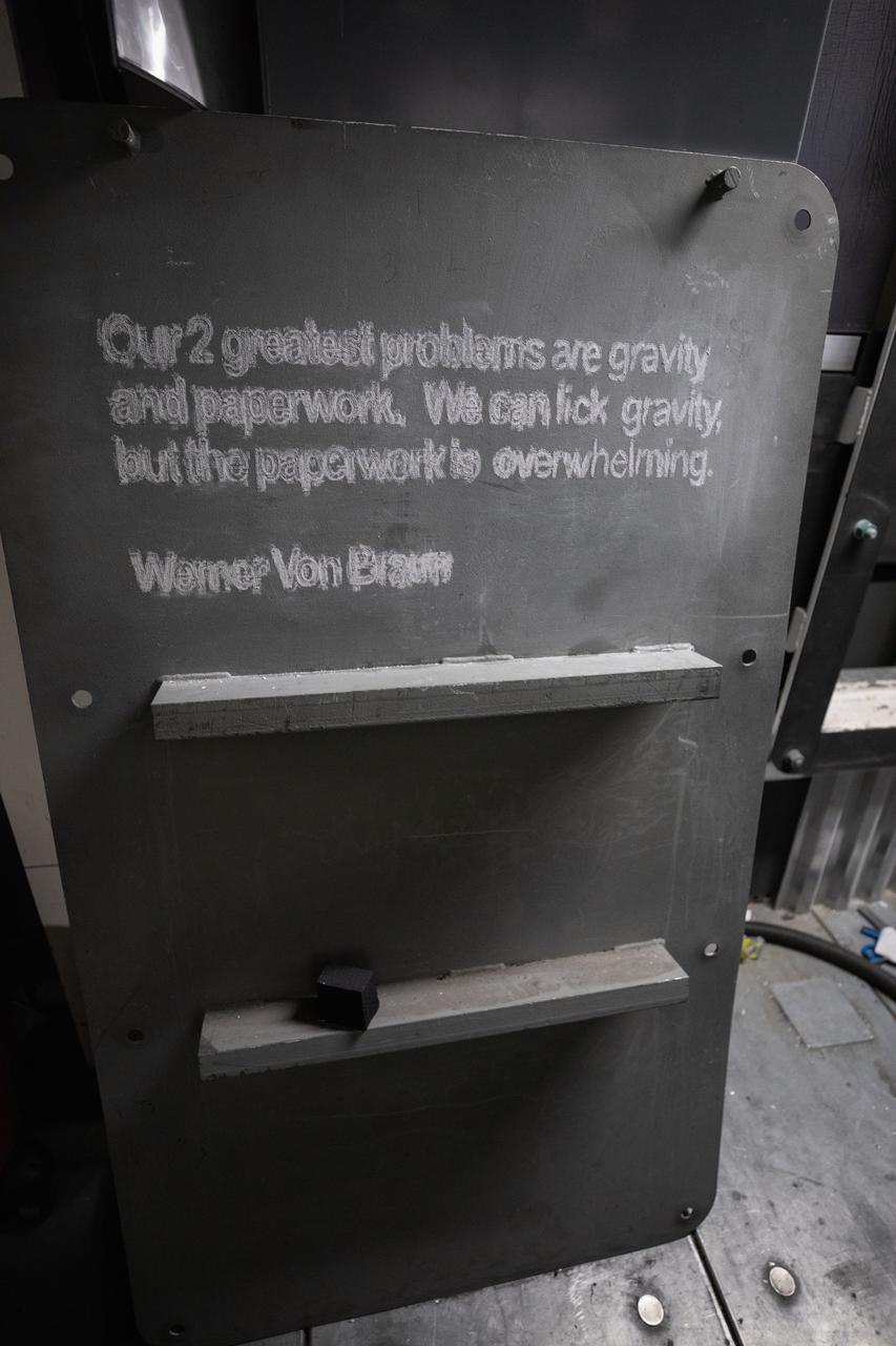 Each of the eight haunch access doors located in the mobile launcher platform contains an inspirational quote related to space travel. The quotes are from John F. Kennedy, H.G. Wells and Werner Von Braun, among others. The heavy metal doors will be bolted in place to protect electrical and support systems during liftoff of the Space Launch System rocket and Orion spacecraft.