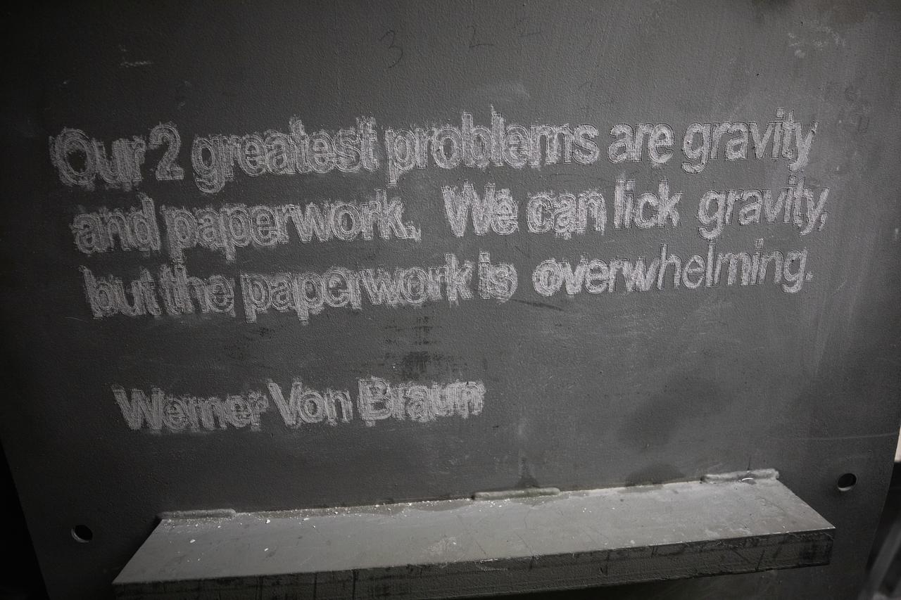 Each of the eight haunch access doors located in the mobile launcher platform contains an inspirational quote related to space travel. The quotes are from John F. Kennedy, H.G. Wells and Werner Von Braun, among others. The heavy metal doors will be bolted in place to protect electrical and support systems during liftoff of the Space Launch System rocket and Orion spacecraft.