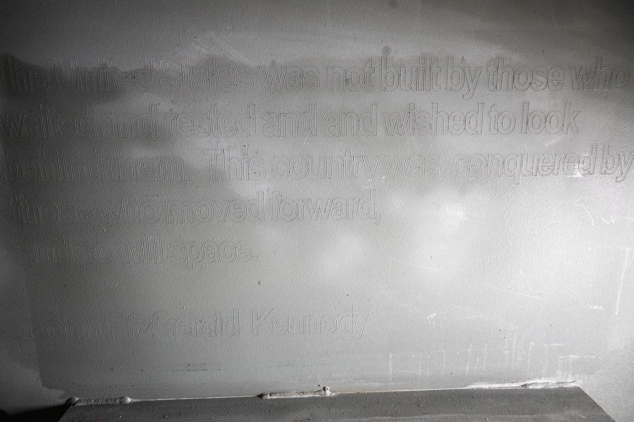 Each of the eight haunch access doors located in the mobile launcher platform contains an inspirational quote related to space travel. The quotes are from John F. Kennedy, H.G. Wells and Werner Von Braun, among others. The heavy metal doors will be bolted in place to protect electrical and support systems during liftoff of the Space Launch System rocket and Orion spacecraft.