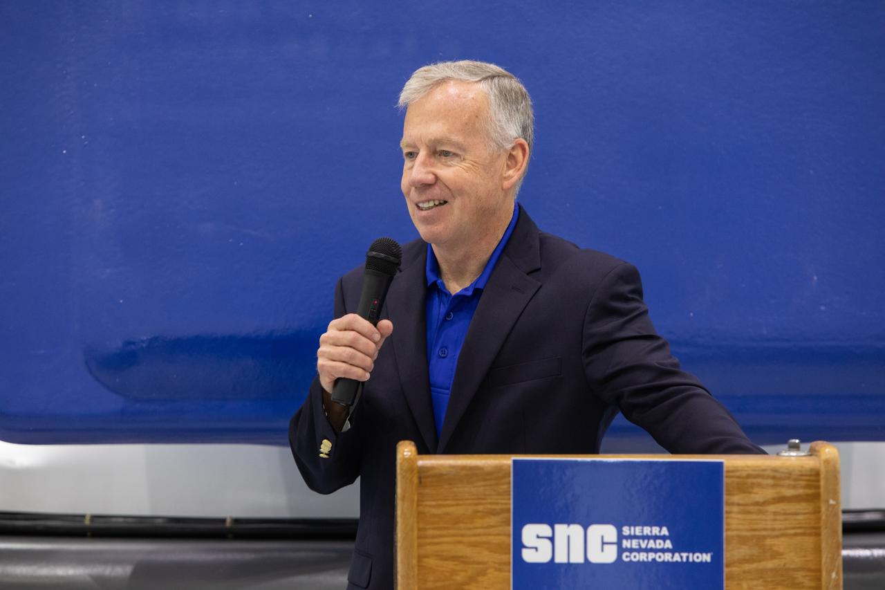 Steve Lindsey, senior vice president of strategy for Sierra Nevada Corporation Space Systems and a former NASA astronaut, discusses the capabilities of the company’s Shooting Star cargo module in the Space Station Processing Facility high bay at Kennedy Space Center on Nov. 19, 2019. Shooting Star will attach to the back of the company’s Dream Chaser spacecraft. The cargo module will deliver more than 12,000 pounds of supplies and other cargo to the International Space Station for NASA as part of the Commercial Resupply Services-2 contract.