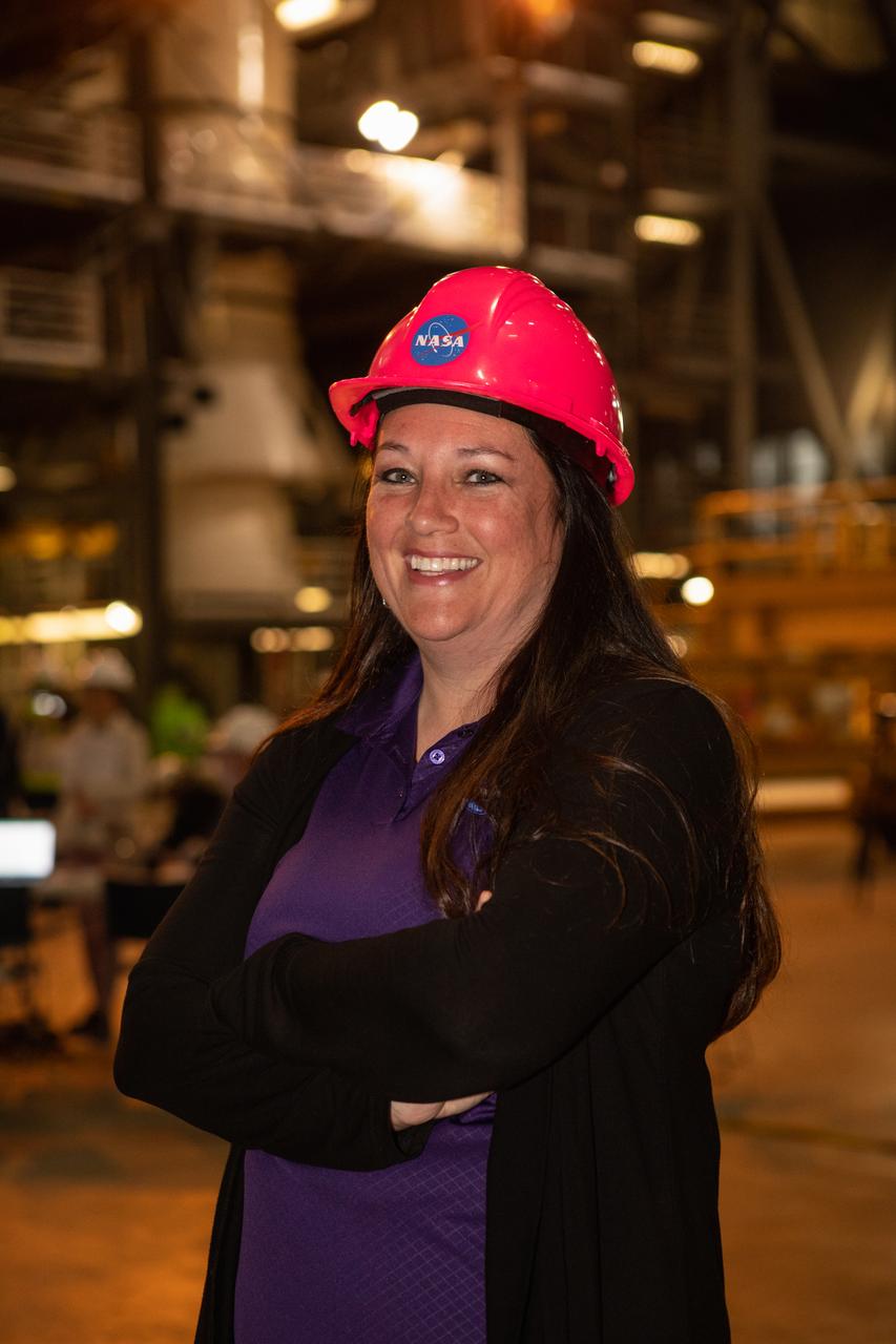 NASA Vehicle Assembly Building (VAB) Element Operations Manager Elizabeth Kline stands inside the VAB’s high bay 4 in front of mockups of the Space Launch System (SLS) booster segments on Nov. 19, 2019. Teams from NASA’s Exploration Ground Systems and SLS practiced booster segment mate, training around the clock from Nov. 18 through Nov. 20. SLS will launch the first woman and next man to the Moon by 2024 through the Artemis program.