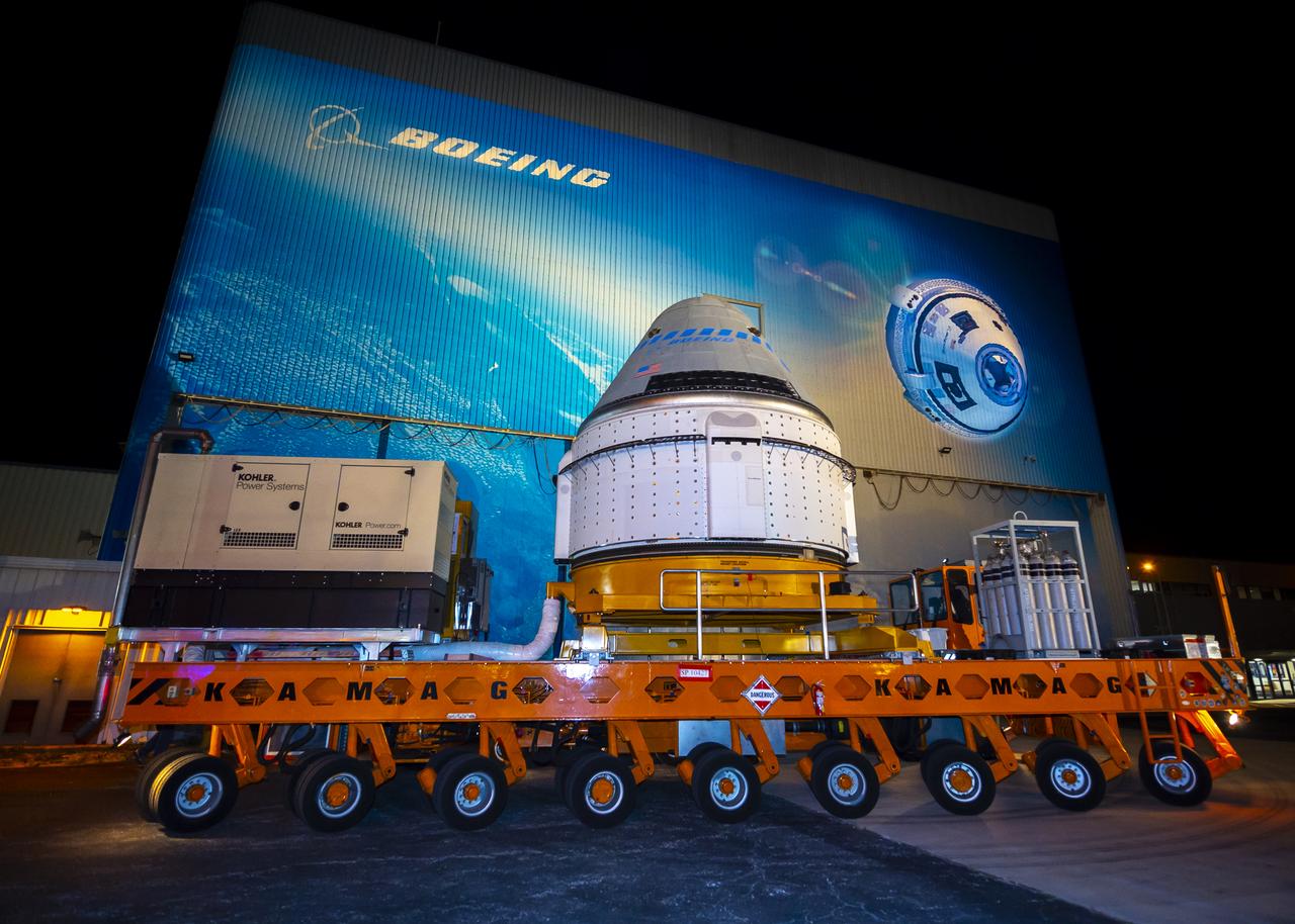 The Boeing CST-100 Starliner spacecraft rolls out from the company’s Commercial Crew and Cargo Processing Facility at NASA’s Kennedy Space Center in Florida on Nov. 21, 2019. The spacecraft will make the trip to Space Launch Complex 41 at Cape Canaveral Air Force Station where it will be secured atop a United Launch Alliance Atlas V rocket for Boeing’s Orbital Flight Test to the International Space Station for NASA’s Commercial Crew Program.