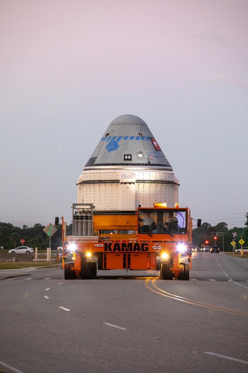 The Boeing CST-100 Starliner spacecraft rolls out from the company’s Commercial Crew and Cargo Processing Facility at NASA’s Kennedy Space Center in Florida on Nov. 21, 2019. The spacecraft will make the trip to Space Launch Complex 41 at Cape Canaveral Air Force Station where it will be prepared for Boeing’s Orbital Flight Test to the International Space Station for NASA’s Commercial Crew Program.