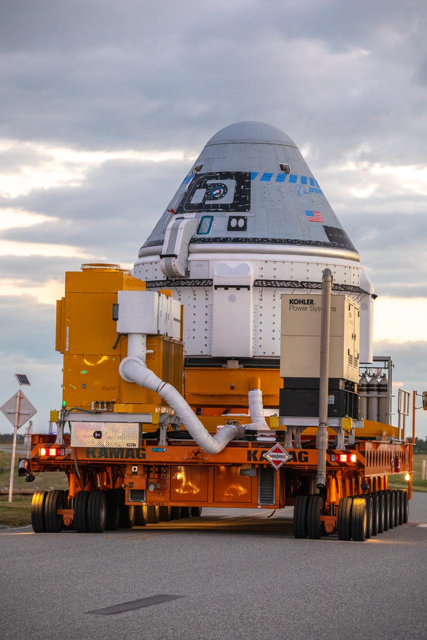 The Boeing CST-100 Starliner spacecraft rolls out from the company’s Commercial Crew and Cargo Processing Facility at NASA’s Kennedy Space Center in Florida on Nov. 21, 2019. The spacecraft will make the trip to Space Launch Complex 41 at Cape Canaveral Air Force Station where it will be prepared for Boeing’s Orbital Flight Test to the International Space Station for NASA’s Commercial Crew Program.