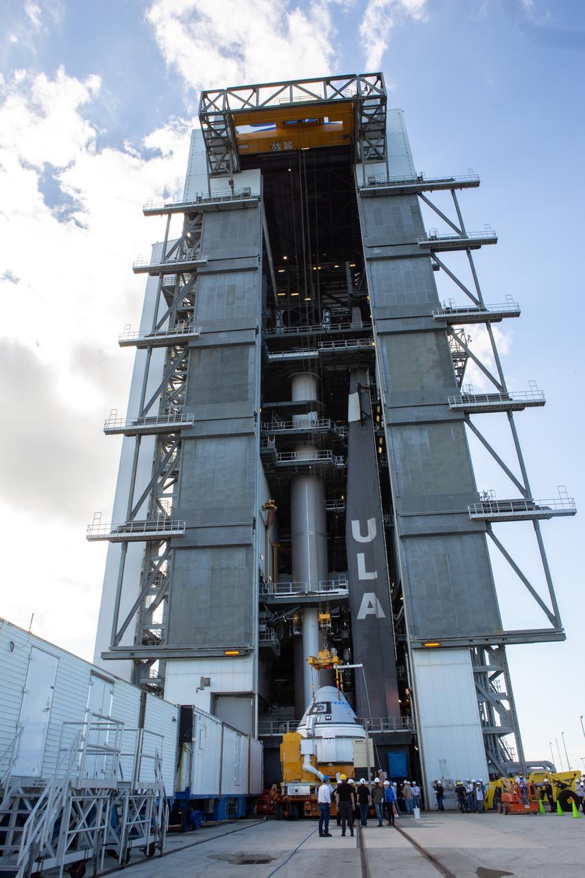 The Boeing CST-100 Starliner spacecraft is lifted at the Vertical Integration Facility at Space Launch Complex 41 at Florida’s Cape Canaveral Air Force Station on Nov. 21, 2019. Starliner will be secured atop a United Launch Alliance Atlas V rocket for Boeing’s Orbital Flight Test to the International Space Station for NASA’s Commercial Crew Program. The spacecraft rolled out from Boeing’s Commercial Crew and Cargo Processing Facility at NASA’s Kennedy Space Center earlier in the day.
