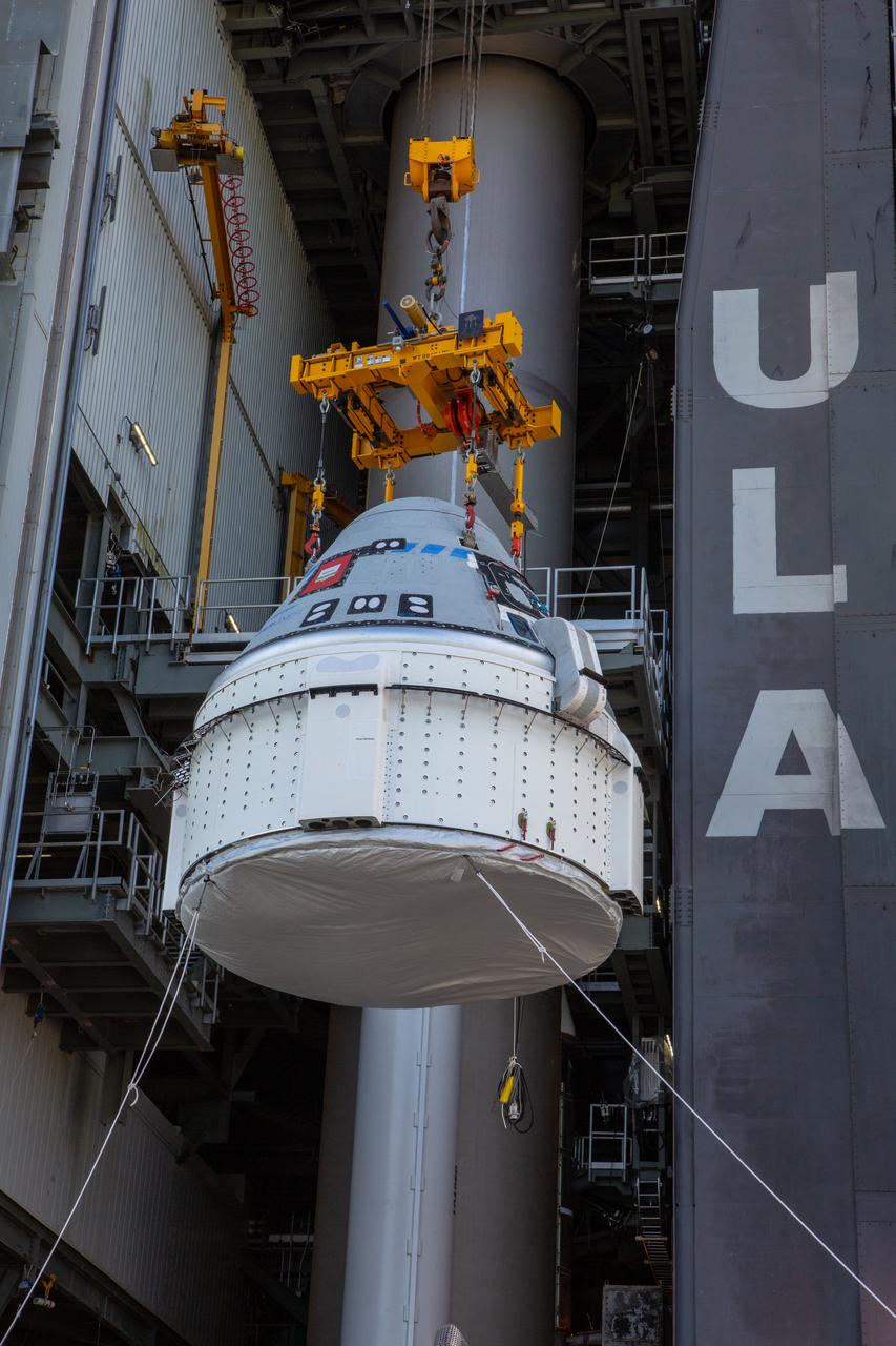 The Boeing CST-100 Starliner spacecraft is lifted at the Vertical Integration Facility at Space Launch Complex 41 at Florida’s Cape Canaveral Air Force Station on Nov. 21, 2019. Starliner will be secured atop a United Launch Alliance Atlas V rocket for Boeing’s Orbital Flight Test to the International Space Station for NASA’s Commercial Crew Program. The spacecraft rolled out from Boeing’s Commercial Crew and Cargo Processing Facility at NASA’s Kennedy Space Center earlier in the day.