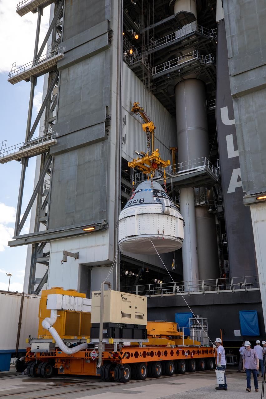 The Boeing CST-100 Starliner spacecraft is lifted at the Vertical Integration Facility at Space Launch Complex 41 at Florida’s Cape Canaveral Air Force Station on Nov. 21, 2019. Starliner will be secured atop a United Launch Alliance Atlas V rocket for Boeing’s Orbital Flight Test to the International Space Station for NASA’s Commercial Crew Program. The spacecraft rolled out from Boeing’s Commercial Crew and Cargo Processing Facility at NASA’s Kennedy Space Center earlier in the day.