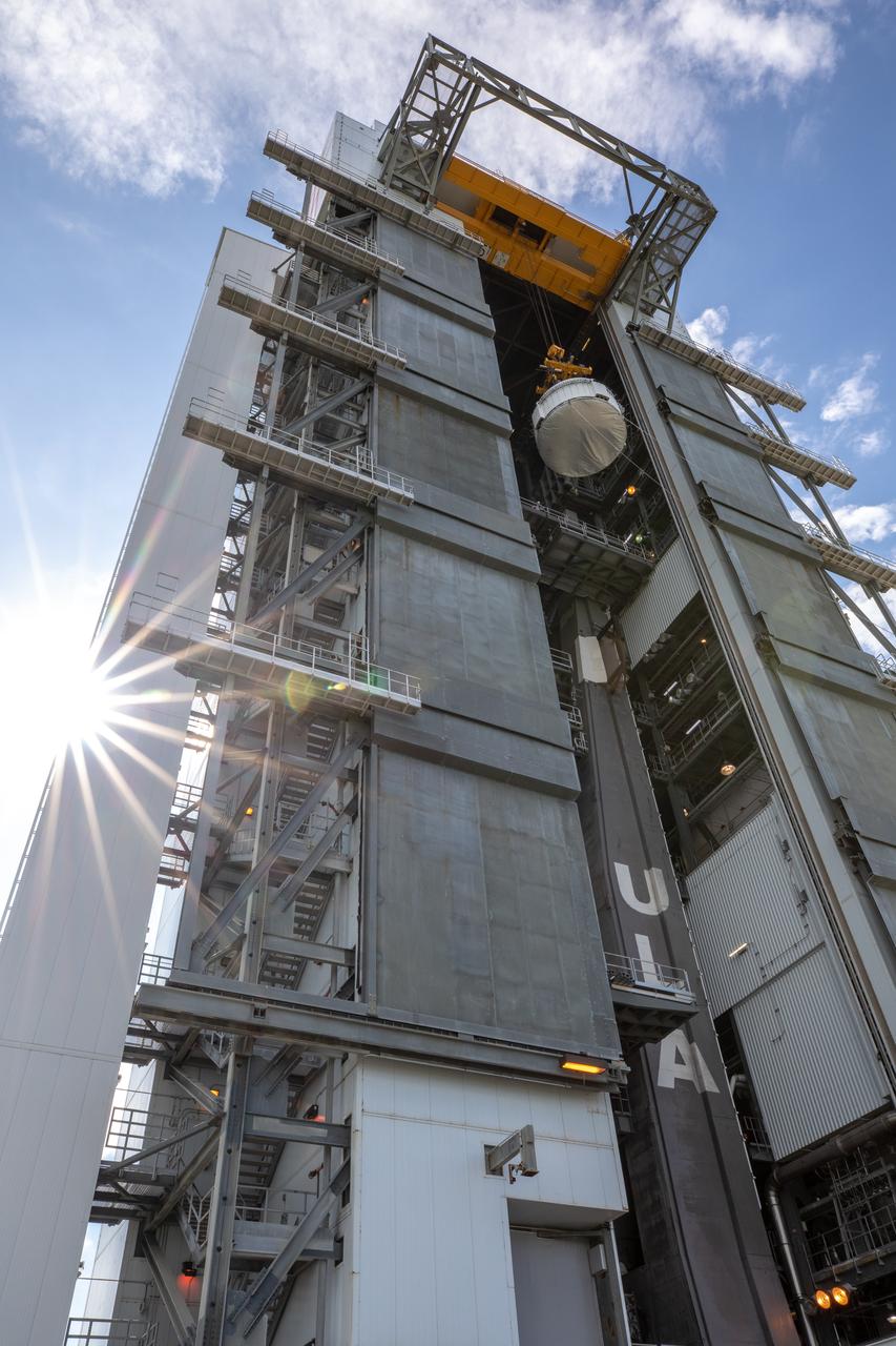 The Boeing CST-100 Starliner spacecraft is lifted at the Vertical Integration Facility at Space Launch Complex 41 at Florida’s Cape Canaveral Air Force Station on Nov. 21, 2019. Starliner will be secured atop a United Launch Alliance Atlas V rocket for Boeing’s Orbital Flight Test to the International Space Station for NASA’s Commercial Crew Program. The spacecraft rolled out from Boeing’s Commercial Crew and Cargo Processing Facility at NASA’s Kennedy Space Center earlier in the day.