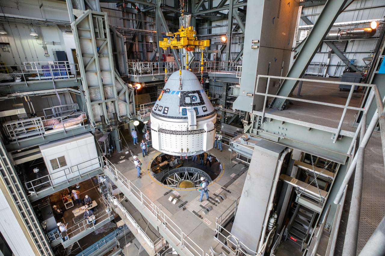 The Boeing CST-100 Starliner spacecraft is guided into position above a United Launch Alliance Atlas V rocket at the Vertical Integration Facility at Space Launch Complex 41 at Florida’s Cape Canaveral Air Force Station on Nov. 21, 2019. Starliner will be secured atop the rocket for Boeing’s Orbital Flight Test to the International Space Station for NASA’s Commercial Crew Program. The spacecraft rolled out from Boeing’s Commercial Crew and Cargo Processing Facility at NASA’s Kennedy Space Center earlier in the day.