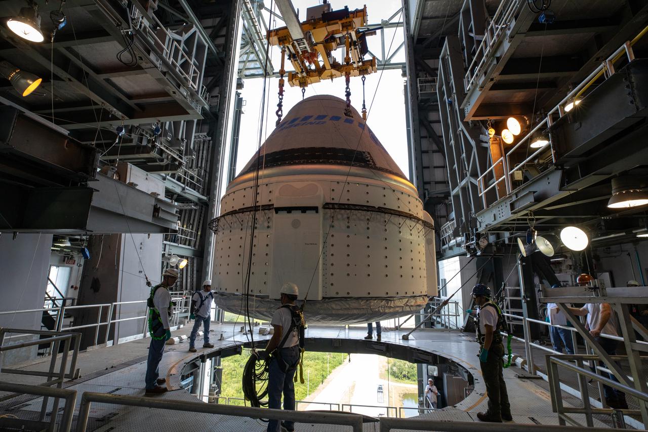 The Boeing CST-100 Starliner spacecraft is guided into position above a United Launch Alliance Atlas V rocket at the Vertical Integration Facility at Space Launch Complex 41 at Florida’s Cape Canaveral Air Force Station on Nov. 21, 2019. Starliner will be secured atop the rocket for Boeing’s Orbital Flight Test to the International Space Station for NASA’s Commercial Crew Program. The spacecraft rolled out from Boeing’s Commercial Crew and Cargo Processing Facility at NASA’s Kennedy Space Center earlier in the day.