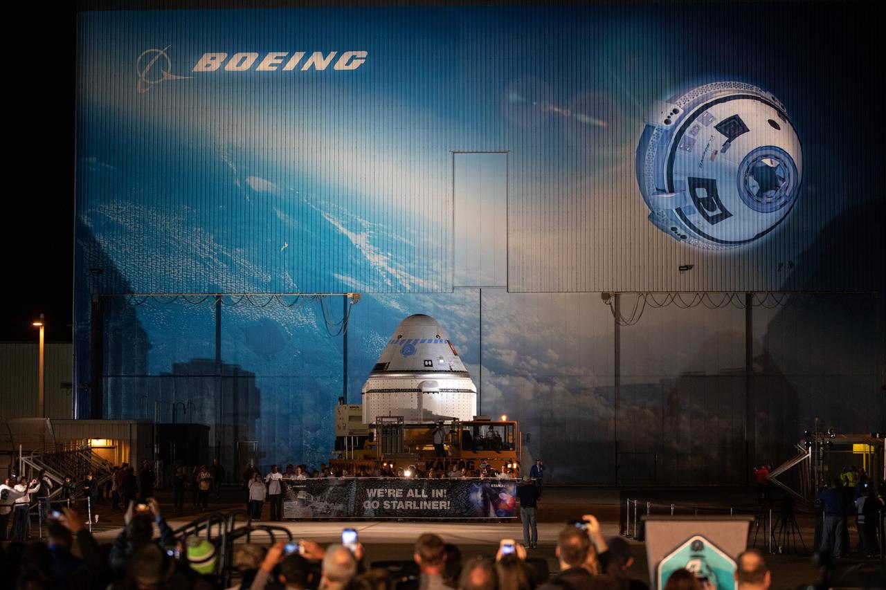 The Boeing CST-100 Starliner spacecraft rolls out from the company’s Commercial Crew and Cargo Processing Facility at NASA’s Kennedy Space Center in Florida on Nov. 21, 2019. The spacecraft will make the trip to Space Launch Complex 41 at Cape Canaveral Air Force Station where it will be secured atop a United Launch Alliance Atlas V rocket for Boeing’s Orbital Flight Test to the International Space Station for NASA’s Commercial Crew Program.