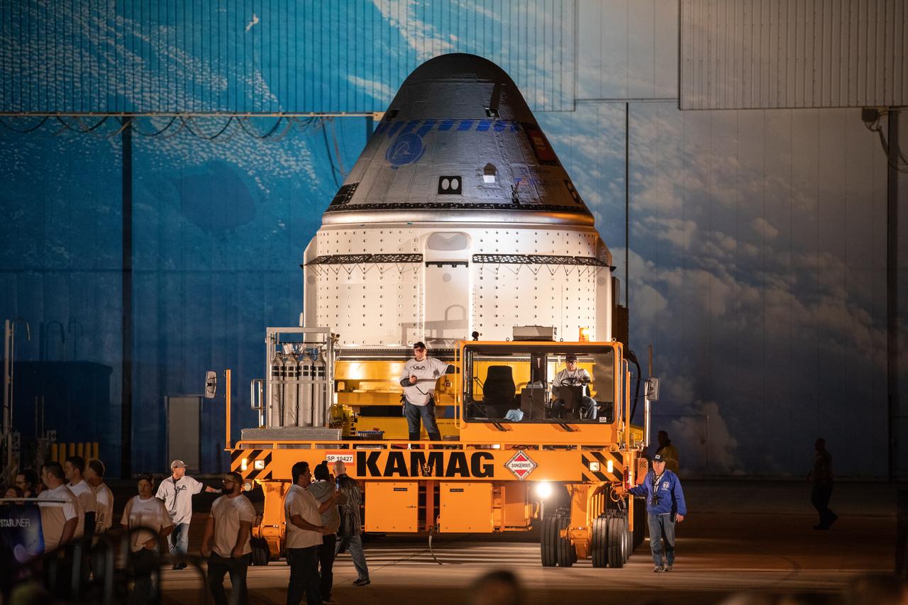 The Boeing CST-100 Starliner spacecraft rolls out from the company’s Commercial Crew and Cargo Processing Facility at NASA’s Kennedy Space Center in Florida on Nov. 21, 2019. The spacecraft will make the trip to Space Launch Complex 41 at Cape Canaveral Air Force Station where it will be secured atop a United Launch Alliance Atlas V rocket for Boeing’s Orbital Flight Test to the International Space Station for NASA’s Commercial Crew Program.