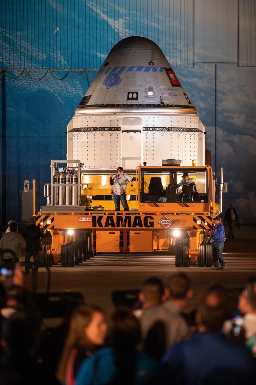 The Boeing CST-100 Starliner spacecraft rolls out from the company’s Commercial Crew and Cargo Processing Facility at NASA’s Kennedy Space Center in Florida on Nov. 21, 2019. The spacecraft will make the trip to Space Launch Complex 41 at Cape Canaveral Air Force Station where it will be secured atop a United Launch Alliance Atlas V rocket for Boeing’s Orbital Flight Test to the International Space Station for NASA’s Commercial Crew Program.