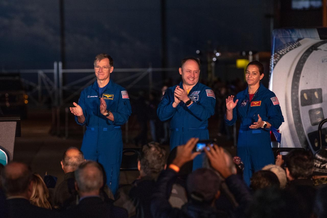 From left to right: Boeing astronaut Chris Ferguson and NASA astronauts Mike Fincke and Nicole Mann applaud during the Boeing CST-100 Starliner spacecraft rollout from the company’s Commercial Crew and Cargo Processing Facility at Kennedy Space Center in Florida on Nov. 21, 2019. Starliner will make the trip to Space Launch Complex 41 at Cape Canaveral Air Force Station where it will be secured atop a United Launch Alliance Atlas V rocket for Boeing’s Orbital Flight Test to the International Space Station for NASA’s Commercial Crew Program.