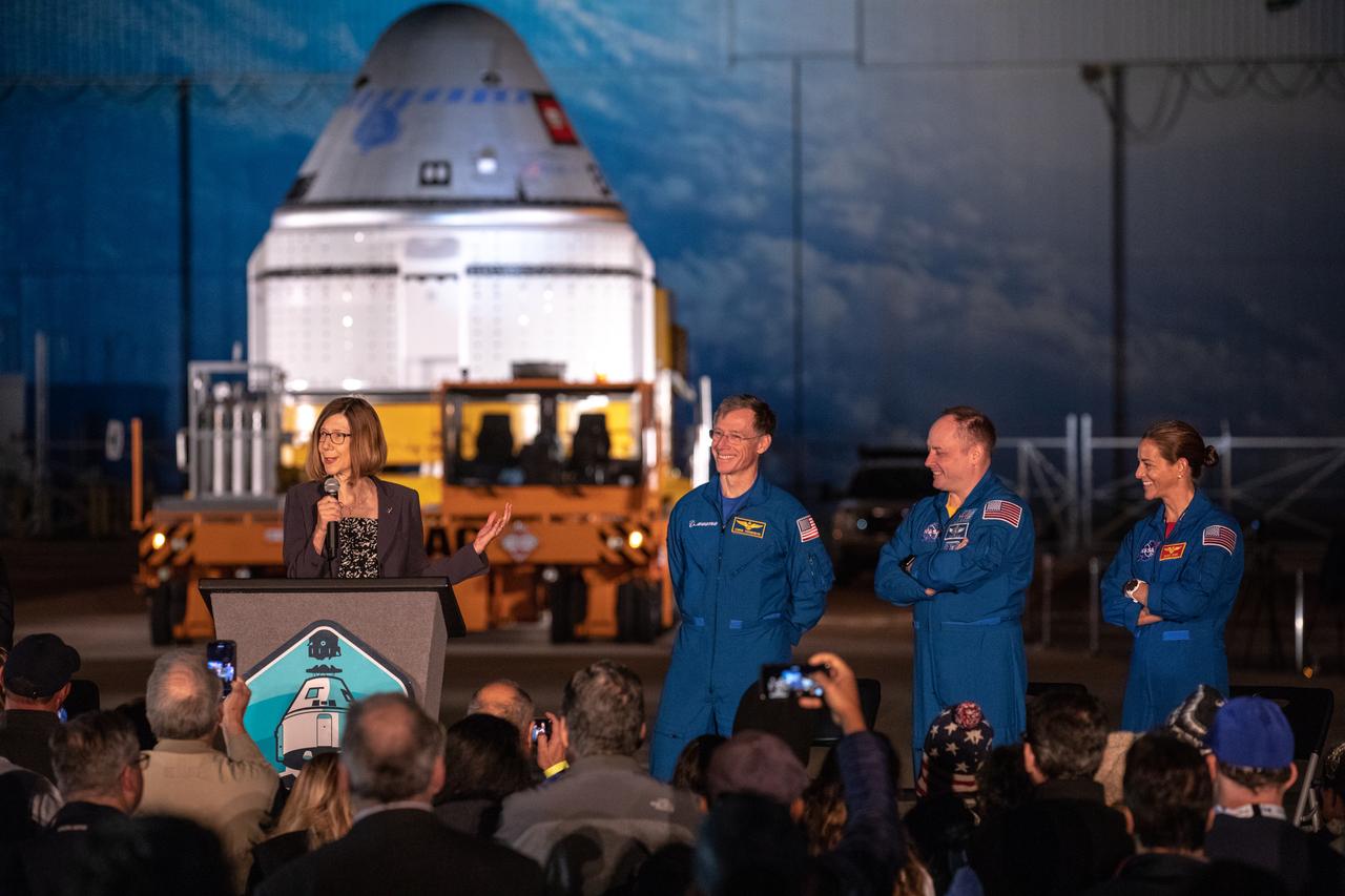 Kathy Lueders, program manager, NASA’s Commercial Crew Program, speaks during the Boeing CST-100 Starliner spacecraft rollout from the company’s Commercial Crew and Cargo Processing Facility at Kennedy Space Center in Florida on Nov. 21, 2019. To her left (from left to right) are Boeing astronaut Chris Ferguson and NASA astronauts Mike Fincke and Nicole Mann. Starliner will make the trip to Space Launch Complex 41 at Cape Canaveral Air Force Station where it will be secured atop a United Launch Alliance Atlas V rocket for Boeing’s Orbital Flight Test to the International Space Station for NASA’s Commercial Crew Program.