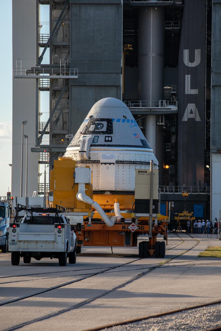 The Boeing CST-100 Starliner spacecraft arrives at the Vertical Integration Facility  at Space Launch Complex 41 at Cape Canaveral Air Force Station in Florida on Nov. 21, 2019. Starliner will be secured atop a United Launch Alliance Atlas V rocket for Boeing’s Orbital Flight Test to the International Space Station for NASA’s Commercial Crew Program. The spacecraft rolled out from Boeing’s Commercial Crew and Cargo Processing Facility at NASA’s Kennedy Space Center earlier in the day.