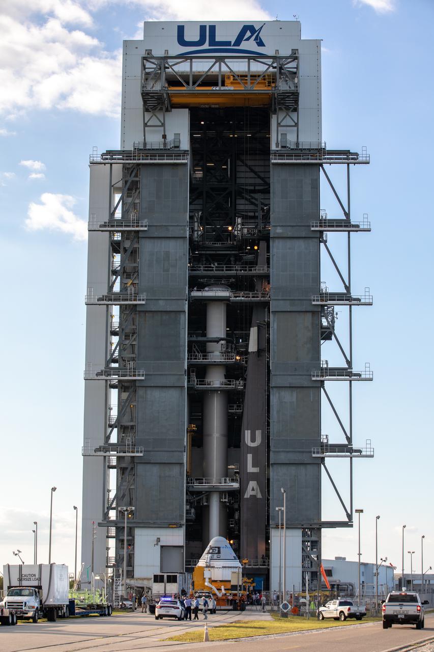 The Boeing CST-100 Starliner spacecraft arrives at the Vertical Integration Facility  at Space Launch Complex 41 at Cape Canaveral Air Force Station in Florida on Nov. 21, 2019. Starliner will be secured atop a United Launch Alliance Atlas V rocket for Boeing’s Orbital Flight Test to the International Space Station for NASA’s Commercial Crew Program. The spacecraft rolled out from Boeing’s Commercial Crew and Cargo Processing Facility at NASA’s Kennedy Space Center earlier in the day.