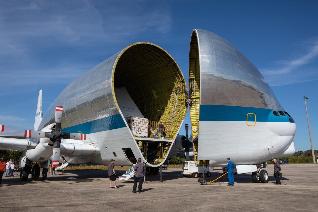 NASA’s Orion spacecraft is loaded into the agency’s Super Guppy aircraft at the Launch and Landing Facility runway at Kennedy Space Center in Florida on Nov. 21, 2019. The spacecraft’s crew and service modules are flying to NASA’s Plum Brook Station in Sandusky, Ohio, for full thermal vacuum testing. In this unique facility, the crew and service modules will be put through extensive testing to ensure they can survive the rigors of launch, space travel, re-entry and splashdown. The Orion spacecraft will launch atop the agency's Space Launch System rocket on Artemis I.