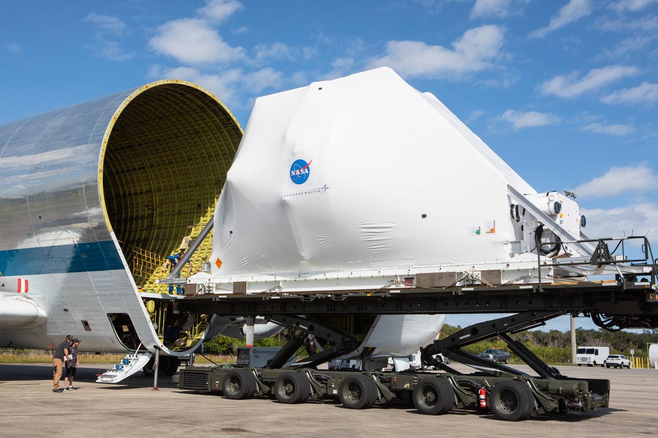 NASA’s Orion spacecraft, wrapped up for shipping, is carefully aligned for loading into the agency’s Super Guppy aircraft at the Launch and Landing Facility runway at Kennedy Space Center in Florida on Nov. 21, 2019. The spacecraft’s crew and service modules are flying to NASA’s Plum Brook Station in Sandusky, Ohio, for full thermal vacuum testing. In this unique facility, the crew and service modules will be put through extensive testing to ensure they can survive the rigors of launch, space travel, re-entry and splashdown. The Orion spacecraft will launch atop the agency's Space Launch System rocket on Artemis I.