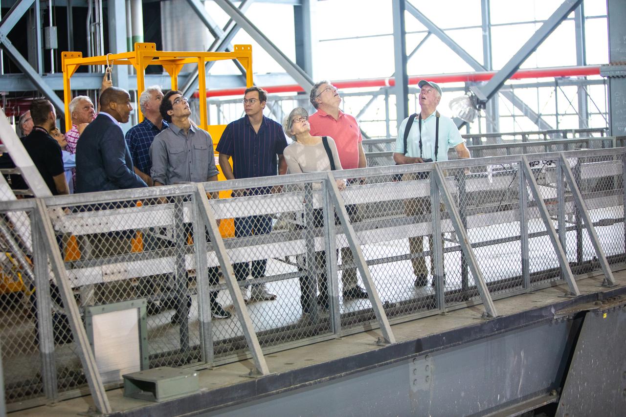 Family members of the original Vehicle Assembly Building (VAB) architect tour the iconic facility on Nov. 22, 2019 at NASA’s Kennedy Space Center in Florida. Among the visitors are Dick Bergmann, far right, original lead designer for the VAB. In view, far left, is Kelvin Manning, Kennedy’s associate director, technical. The Florida Section American Society of Civil Engineers bestowed its National Historic Civil Engineering Landmark award to the facility. The VAB is the first building at Kennedy Space Center to earn this distinction. At the time of its completion, the 129-million-cubic-foot structure was the largest building in the world. Originally designed and built to accommodate the Saturn V/Apollo used in Project Apollo, the VAB was later modified for its role in the Space Shuttle Program.
