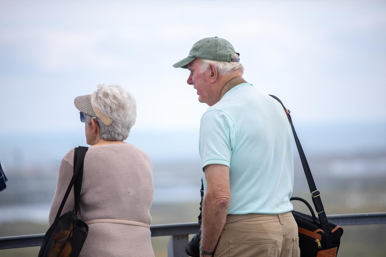 Dick Bergmann, at right, original lead designer for the Vehicle Assembly Building, stands on the roof of the iconic facility during a tour on Nov. 22, 2019 at NASA’s Kennedy Space Center in Florida. The VAB was recognized with the National Historic Civil Engineering Landmark award by the Florida Section American Society of Civil Engineers during a ceremony on Jan. 10, 2020. The VAB is the first building at Kennedy Space Center to earn this distinction. At the time of its completion, the 129-million-cubic-foot structure was the largest building in the world. Originally designed and built to accommodate the Saturn V/Apollo used in Project Apollo, the VAB was later modified for its role in the Space Shuttle Program.