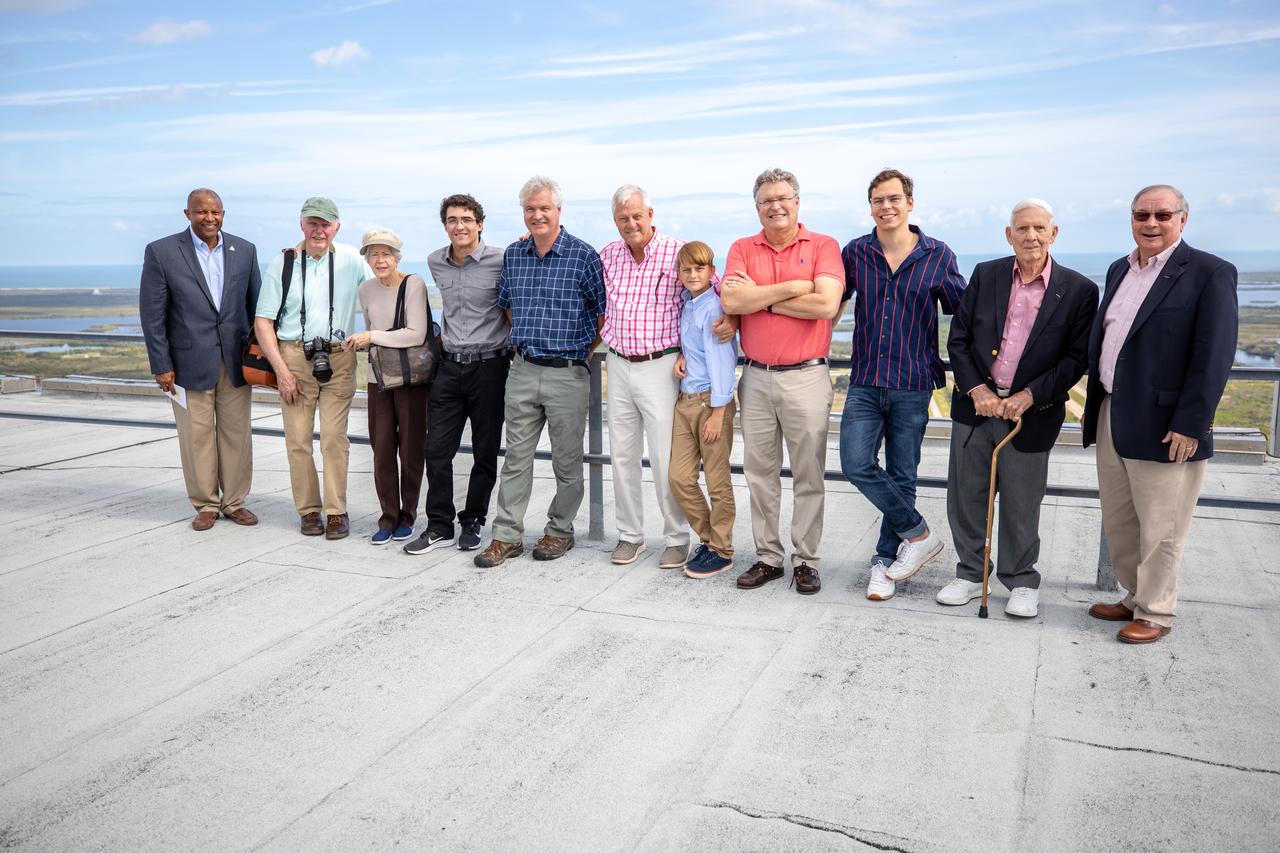 Dick Bergmann, second from left, original lead designer for the Vehicle Assembly Building (VAB), and Phil Moyer, second from right, original project lead, are on the roof of the VAB during a tour of Kennedy Space Center in Florida with descendants of Max Urbahn, the original architect, on Nov. 22, 2019. At far left is Kelvin Manning, Kennedy associate director, technical. The Florida Section American Society of Civil Engineers bestowed its National Historic Civil Engineering Landmark award to the facility. The VAB is the first building at Kennedy Space Center to earn this distinction. At the time of its completion, the 129-million-cubic-foot structure was the largest building in the world. Originally designed and built to accommodate the Saturn V/Apollo used in Project Apollo, the VAB was later modified for its role in the Space Shuttle Program.
