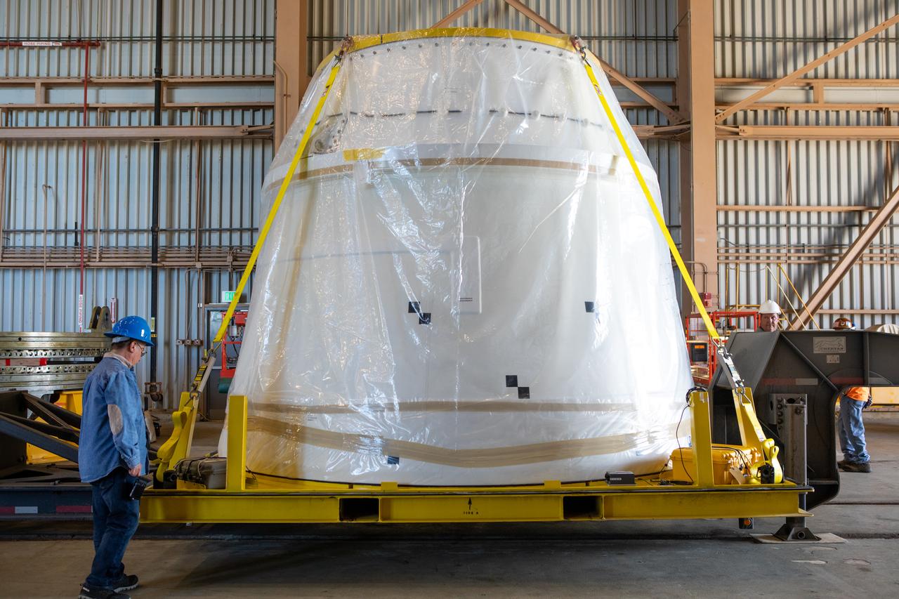 The shipping container has been removed from the second of two Northrop Grumman-manufactured aft exit cones to arrive for the Space Launch System’s solid rocket boosters inside the Rotation, Processing and Surge Facility at NASA’s Kennedy Space Center in Florida on Dec. 9, 2019. The right aft exit cone was shipped from Promontory, Utah. It will be checked out and prepared for the Artemis I uncrewed test flight. The aft exit cones sit at the bottommost part of the twin boosters. The cones help provide added thrust for the boosters, while protecting the aft skirts from the thermal environment during launch.