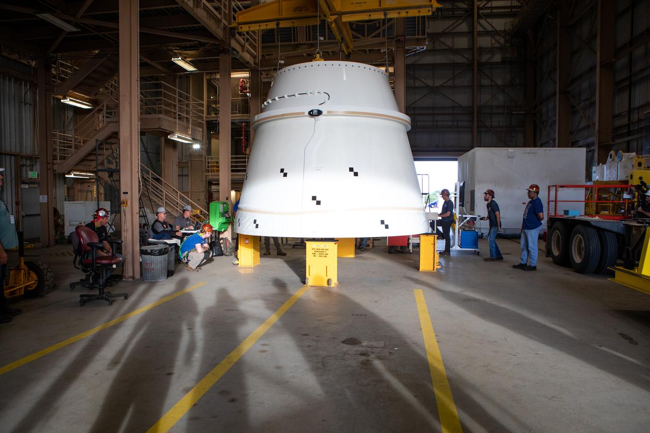 The Northrop Grumman-manufactured right aft exit cone, the second of two for the Space Launch System’s solid rocket boosters, is in view inside the Rotation, Processing and Surge Facility at NASA’s Kennedy Space Center in Florida on Dec. 9, 2019. The aft exit cone was shipped from Promontory, Utah. It will be checked out and prepared for the Artemis I uncrewed test flight. The aft exit cones sit at the bottommost part of the twin boosters. The cones help provide added thrust for the boosters, while protecting the aft skirts from the thermal environment during launch.