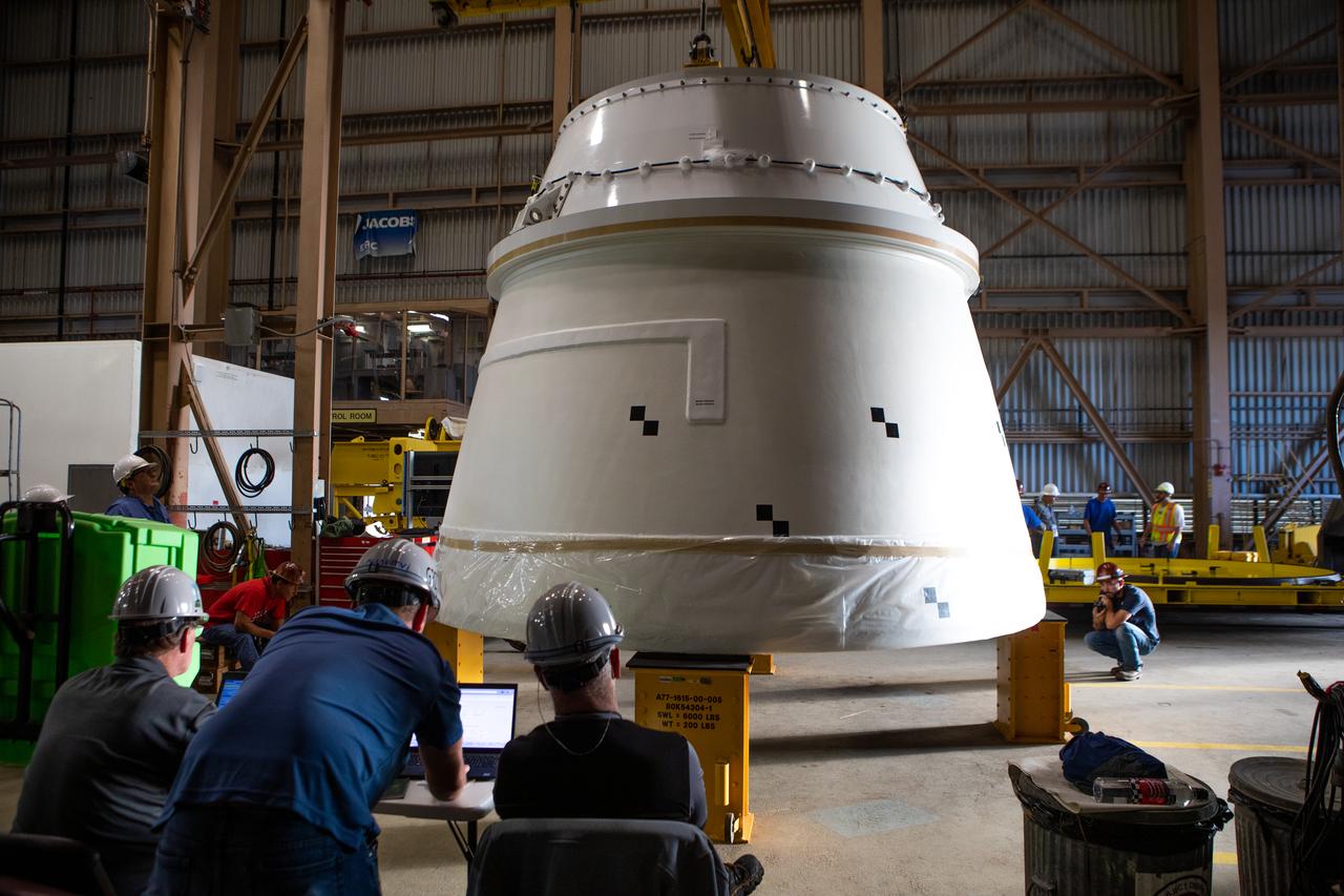 The Northrop Grumman-manufactured right aft exit cone, the second of two for the Space Launch System’s solid rocket boosters, is in view inside the Rotation, Processing and Surge Facility at NASA’s Kennedy Space Center in Florida on Dec. 9, 2019. Both aft exit cones were shipped from Promontory, Utah. They will be checked out and prepared for the Artemis I uncrewed test flight. The aft exit cones sit at the bottommost part of the twin boosters. The cones help provide added thrust for the boosters, while protecting the aft skirts from the thermal environment during launch.