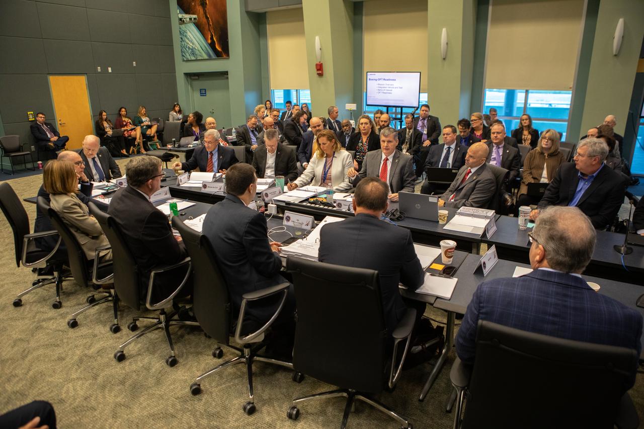 Steve Stich, center, deputy manager of NASA’s Commercial Crew Program and launch operations manager for Boeing’s Orbital Flight Test (OFT), speaks during the flight readiness review for the upcoming OFT launch in Operations Support Building 2 at NASA’s Kennedy Space Center in Florida, Dec. 12, 2019. Boeing’s CST-100 Starliner spacecraft will launch atop a United Launch alliance Atlas V rocket from Space Launch Complex 41 at Cape Canaveral Air Force Station. The uncrewed Orbital Flight Test will be the Starliner’s first flight to the International Space Station for NASA’s Commercial Crew Program.