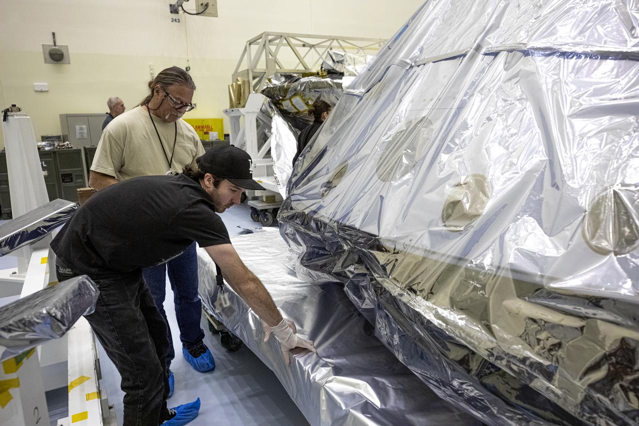 The heat shield and back shell for the Mars 2020 rover are unboxed inside the Payload Hazardous Servicing Facility at NASA’s Kennedy Space Center on Dec. 13, 2019. The two integral pieces of equipment, which were flown to the Florida spaceport from Lockheed Martin Space in Denver, Colorado, will protect the rover during its passage to Mars. The Mars 2020 rover is being manufactured at NASA’s Jet Propulsion Laboratory in California. When completed, the rover will be delivered to Kennedy in mid-February, 2020, with the mission scheduled to launch in the summer of 2020.