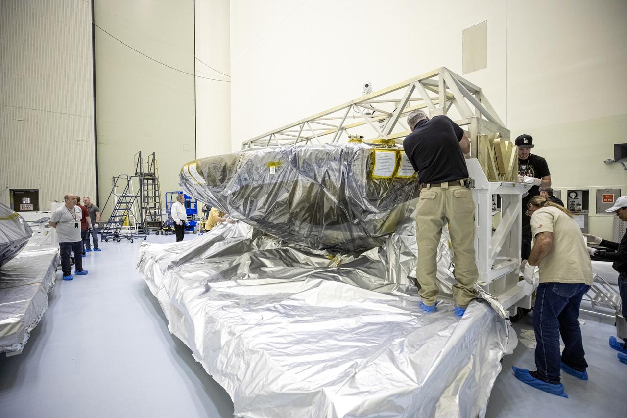 The heat shield and back shell for the Mars 2020 rover are unboxed inside the Payload Hazardous Servicing Facility at NASA’s Kennedy Space Center on Dec. 13, 2019. The two integral pieces of equipment, which were flown to the Florida spaceport from Lockheed Martin Space in Denver, Colorado, will protect the rover during its passage to Mars. The Mars 2020 rover is being manufactured at NASA’s Jet Propulsion Laboratory in California. When completed, the rover will be delivered to Kennedy in mid-February, 2020, with the mission scheduled to launch in the summer of 2020.