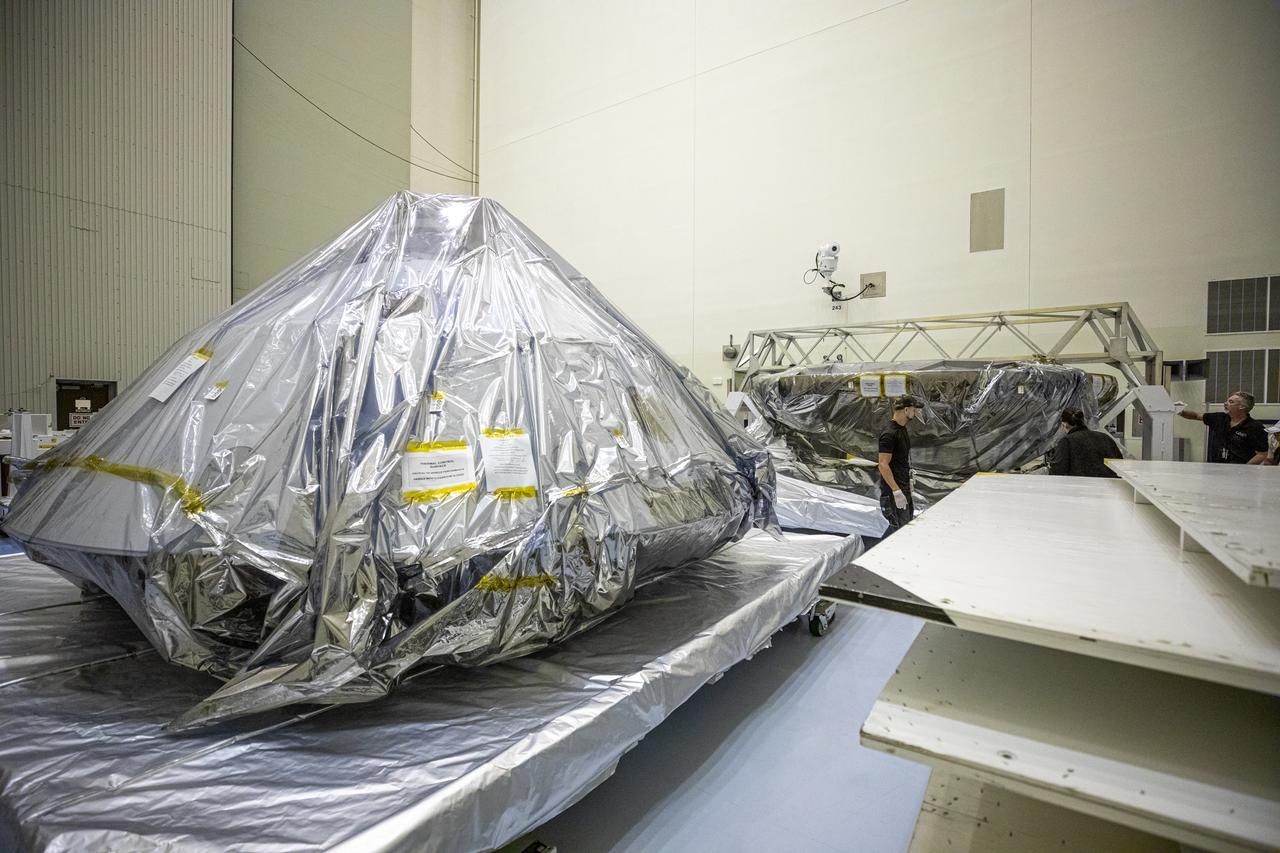 The heat shield and back shell for the Mars 2020 rover are unboxed inside the Payload Hazardous Servicing Facility at NASA’s Kennedy Space Center on Dec. 13, 2019. The two integral pieces of equipment, which were flown to the Florida spaceport from Lockheed Martin Space in Denver, Colorado, will protect the rover during its passage to Mars. The Mars 2020 rover is being manufactured at NASA’s Jet Propulsion Laboratory in California. When completed, the rover will be delivered to Kennedy in mid-February, 2020, with the mission scheduled to launch in the summer of 2020.
