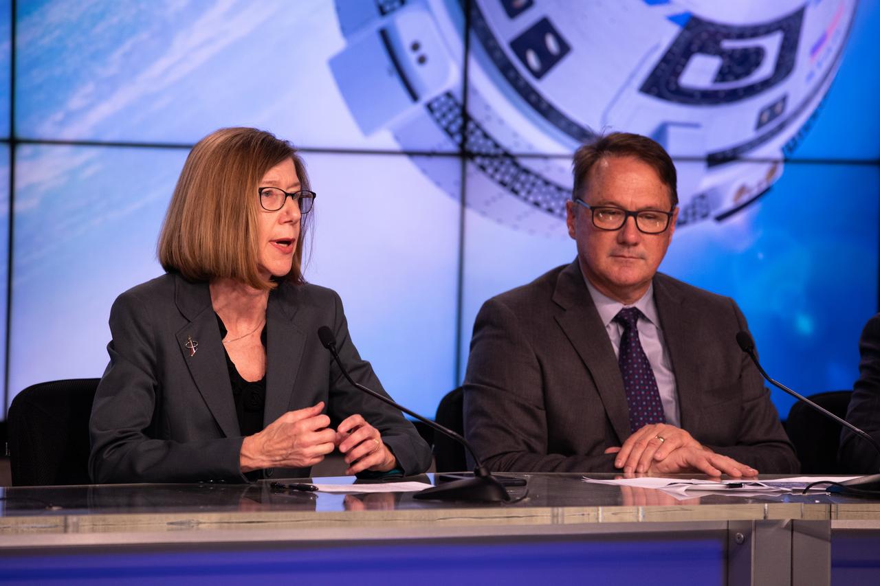 Kathy Lueders, NASA Commercial Crew Program, at left, and John Mulholland, vice president and program manager, Boeing Commercial Crew Program, speak during a prelaunch briefing for Boeing’s Orbital Flight Test at the agency’s Kennedy Space Center in Florida, Dec. 17, 2019. Boeing’s CST-100 Starliner spacecraft will launch atop a United Launch Alliance Atlas V rocket from Space Launch Complex 41 at Cape Canaveral Air Force Station. The uncrewed Orbital Flight Test will be the Starliner’s first flight to the International Space Station for NASA’s Commercial Crew Program.
