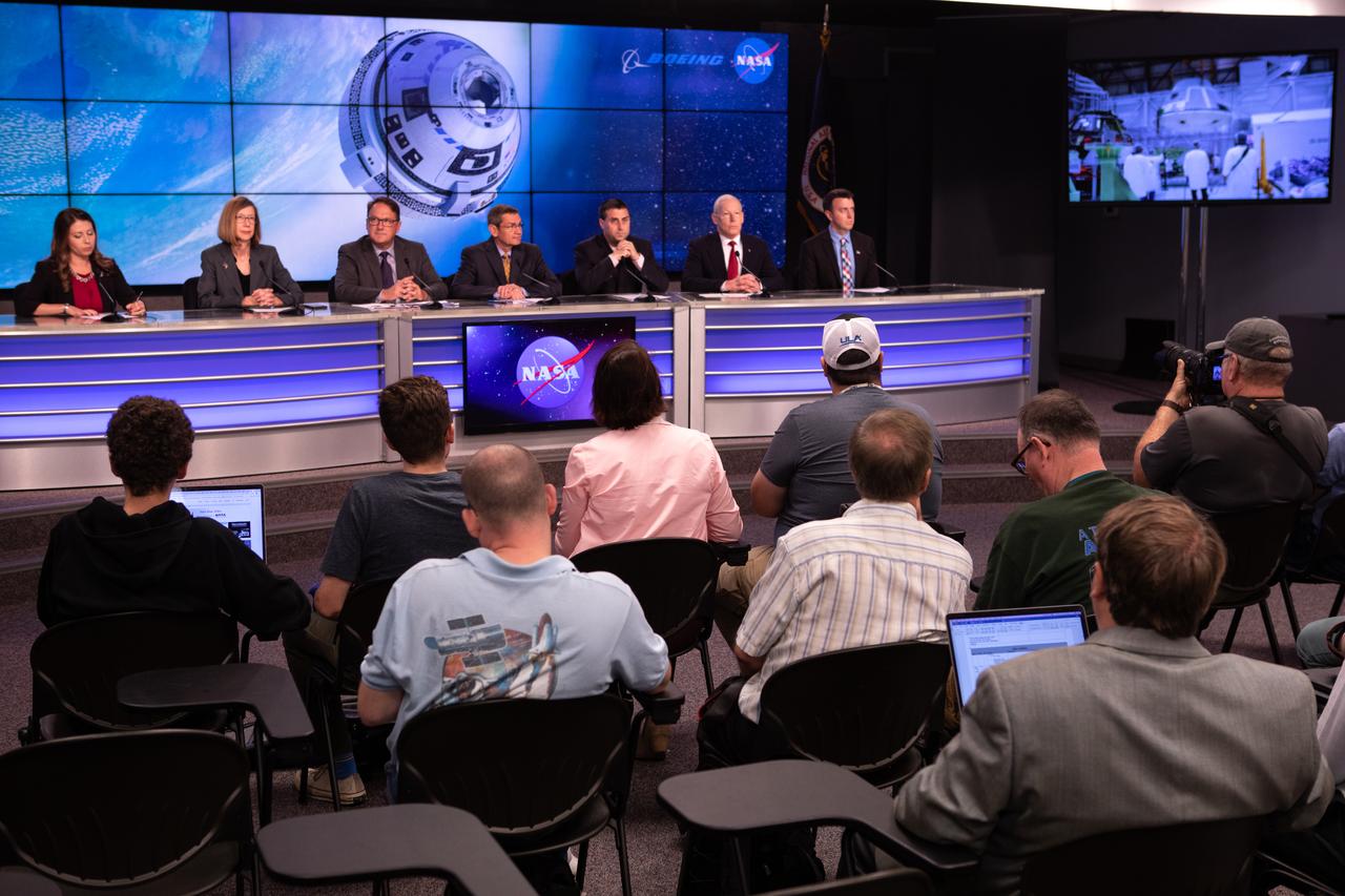 Officials from NASA, Boeing, United Launch Alliance and the U.S. Air Force 45th Weather Squadron participate in a prelaunch briefing for Boeing’s Orbital Flight Test at the agency’s Kennedy Space Center in Florida, Dec. 17, 2019. From left to right are Marie Lewis, NASA Communications; Kathy Lueders, NASA Commercial Crew Program; John Mulholland, vice president and program manager, Boeing Commercial Crew Program; John Elbon, chief operating officer, United Launch Alliance; Joel Montalbano, deputy manager, International Space Station Program; Pat Forrester, Astronaut Office chief, Johnson Space Center; and Will Ulrich, launch weather officer, 45th Weather Squadron. Boeing’s CST-100 Starliner spacecraft will launch atop a United Launch Alliance Atlas V rocket from Space Launch Complex 41 at Cape Canaveral Air Force Station. The uncrewed Orbital Flight Test will be the Starliner’s first flight to the International Space Station for NASA’s Commercial Crew Program.